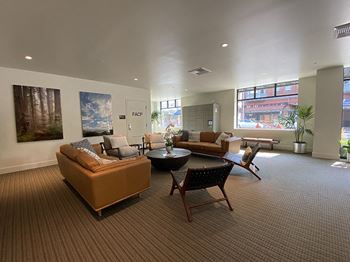 Large room with seating and package lockers